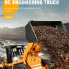 A yellow RC engineering truck excavator model is shown loading a black dump battle plate with gravel.