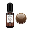 A dark brown glass bottle of Coffee resin pigment with a round, brown pigment bead next to it.