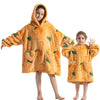 A young girl and boy wearing matching orange flannel hooded sweaters for winter.