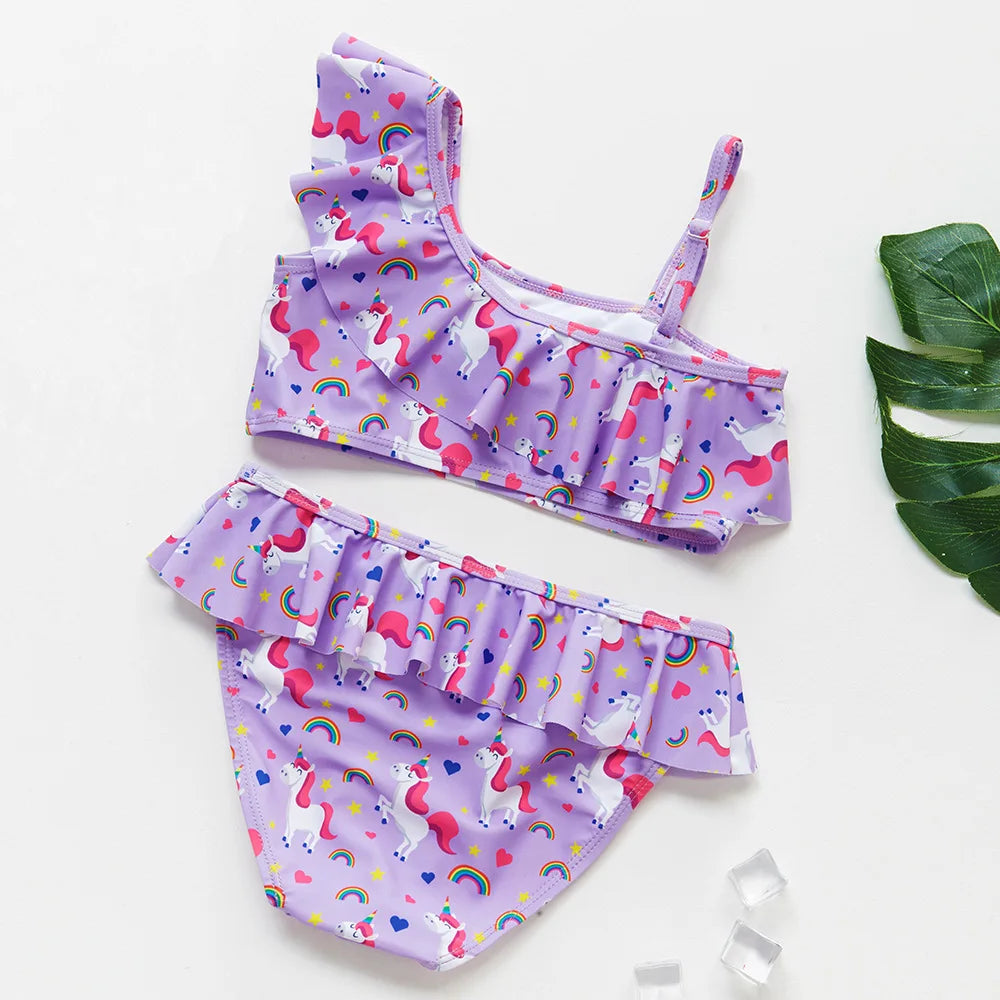 A purple and pink girls' two-piece rainbow swimsuit set featuring a colorful pattern.
