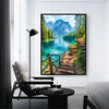 A framed painting of a scenic mountain lake with lush green trees and rugged cliffs.