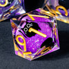 A purple liquid core resin die with sharp edges featuring a black cat silhouette and gold numbers
