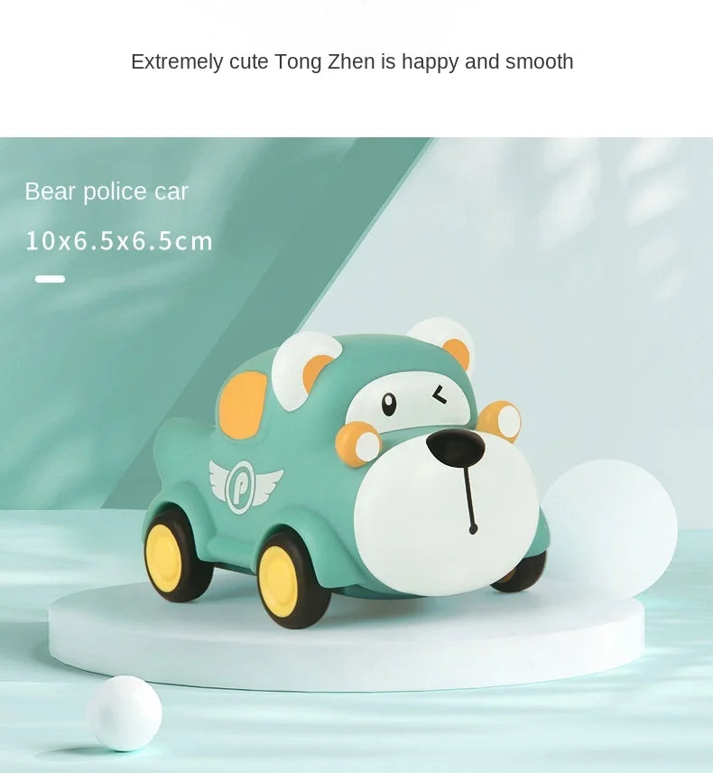 A cute green bear police car toy with yellow accents is displayed on a white circular base.