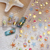 Clear stickers featuring gold starfish and seashell designs for nail art