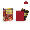 A box of Dragon Shield 100 standard size card sleeves in red and black packaging.