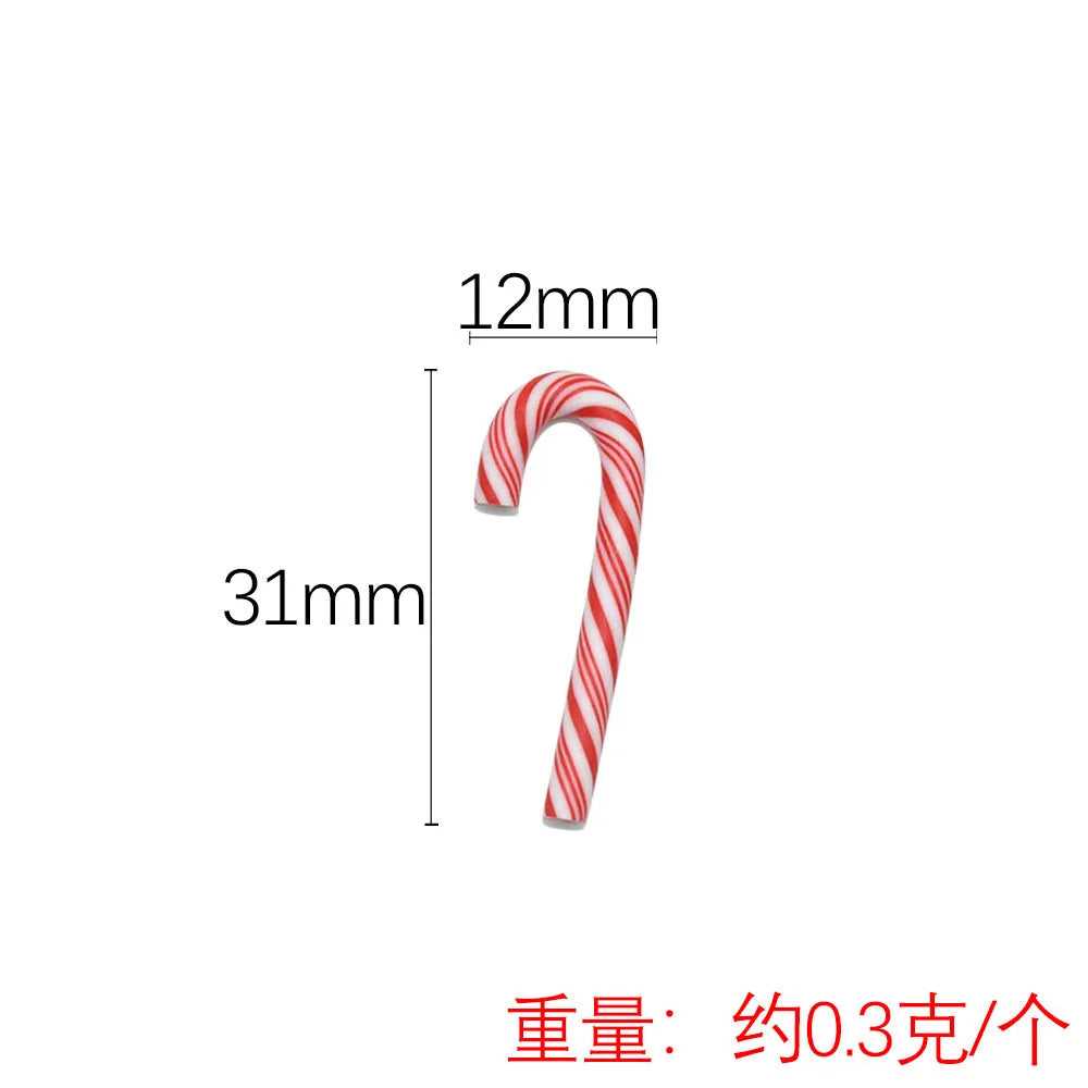 A red and white striped candy cane shaped polymer clay charm, 12mm long.
