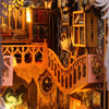 A detailed diorama of a DIY book nook kit featuring miniature furniture, bookshelves, and architectural elements.
