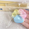 A hand holds a set of colorful silicone cat claw squeeze toys for stress relief and fidgeting.