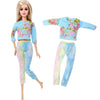 A fashion doll outfit set featuring a floral print top and matching pants in shades of blue, pink, and yellow.