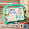 A teal magnetic drawing board for kids with brushes, stamps, and an album tool.