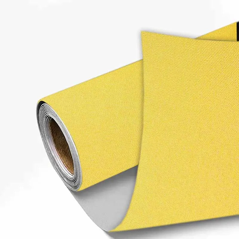 Yellow linen book binding cloth rolled for use in albums and scrapbooks
