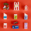 A collection of colorful mini building blocks and food items including corn flakes, pop, and brickless sets.