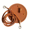 A round, tan leather bag hardware kit featuring a strap and metal findings.
