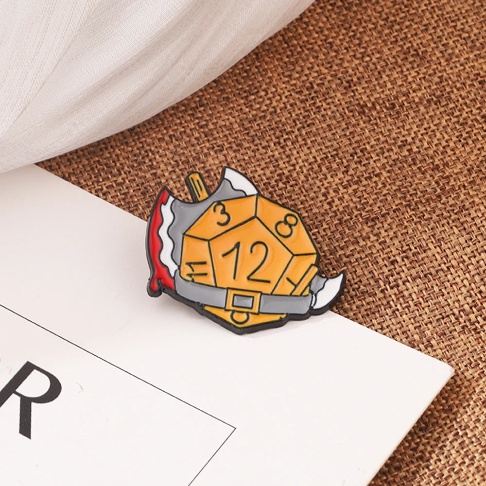 Enamel pin set featuring a dragon dice design with numbers and a gold-colored frame