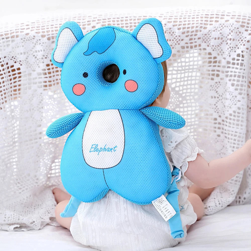 Sac à dos de protection ajustable en forme d'éléphant bleu pour enfant, sur fond blanc.