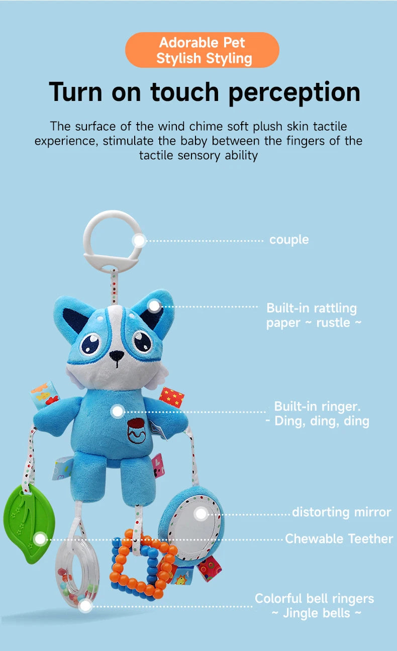 A blue plush toy with ears, feet, and a rattle attached to a hanging loop.