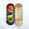 A wooden fingerboard deck featuring a colorful, UV-printed graphic of food items.
