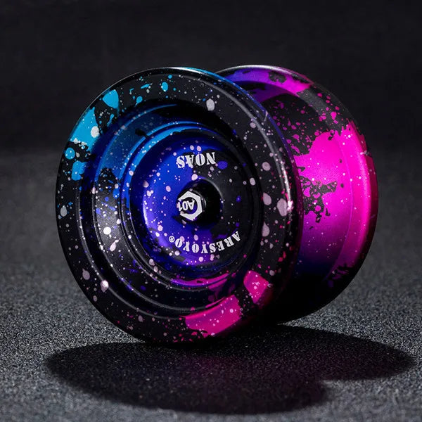 A close-up shot of a professional aluminum alloy yo-yo with high-speed ball bearing in dark blue and magenta colors.
