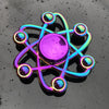 A rainbow metal fidget spinner with smooth silent rotation, featuring glowing iridescent spheres.