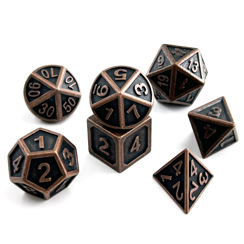 A set of premium metal polyhedral dice in a dark bronze finish, including a dodecahedron and an icosahedron.