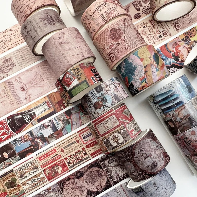 A collection of vintage patterned washi tape rolls and paper scraps for crafting and journaling