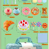 A display of a pretend play picnic and tea party set including cutlery food items and a woven basket