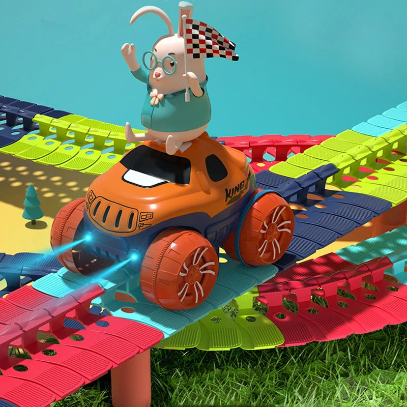 A rabbit character wearing glasses and a checkered flag sits on an orange race car track set with green and red terrain.