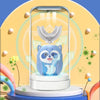 A blue panda-shaped electric toothbrush is displayed inside a clear tube with a light, surrounded by glowing green energy lin
