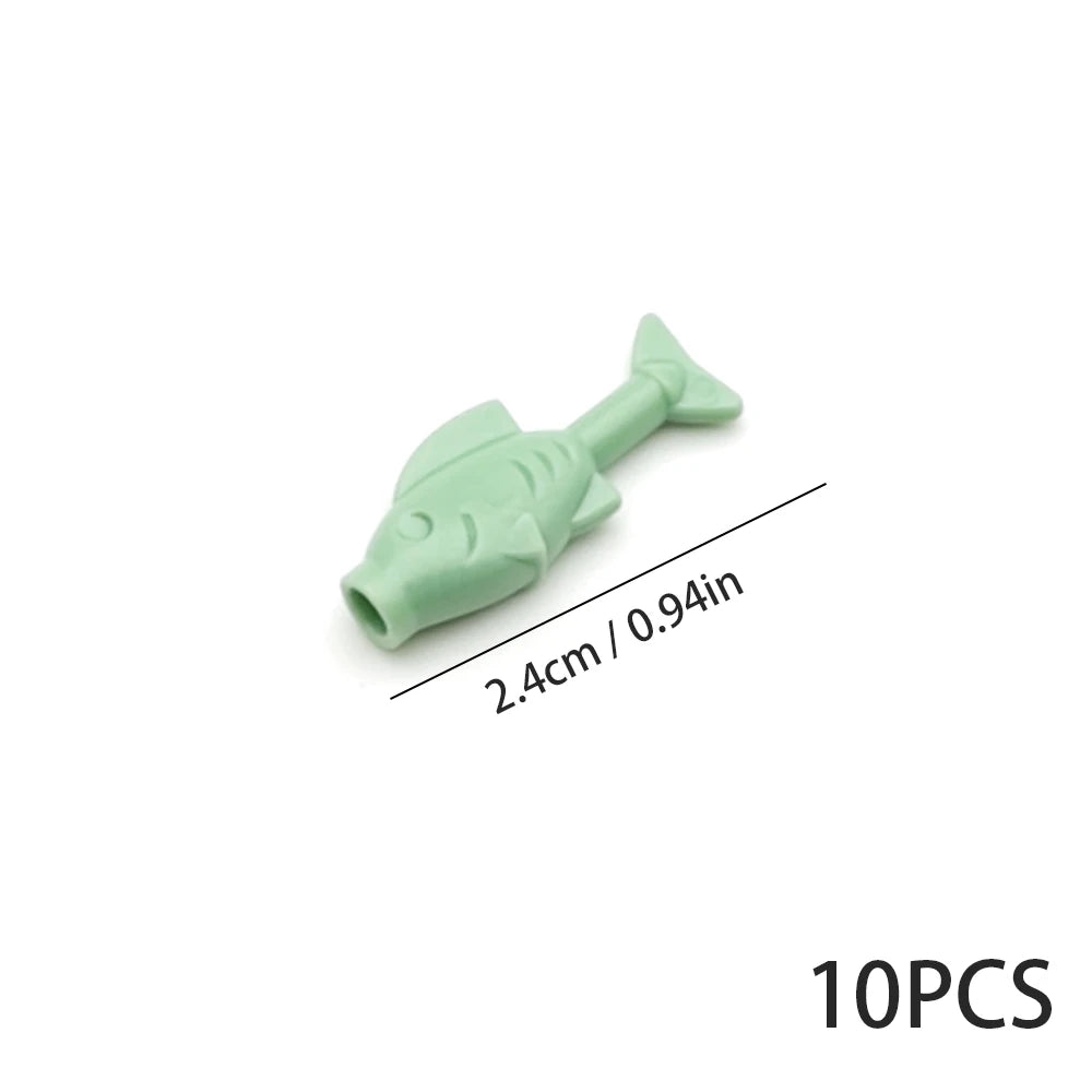 A light green plastic marine creature building block with a tail, shown against a white background.