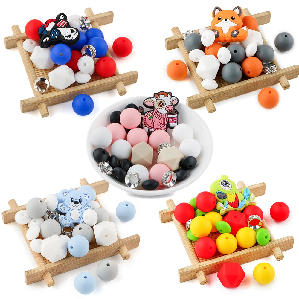 Assortment of colorful cartoon animal silicone beads for DIY jewelry making displayed on wooden trays.