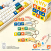 A collection of Miffy keycap pendants and blind box collectibles displayed next to a keyboard.