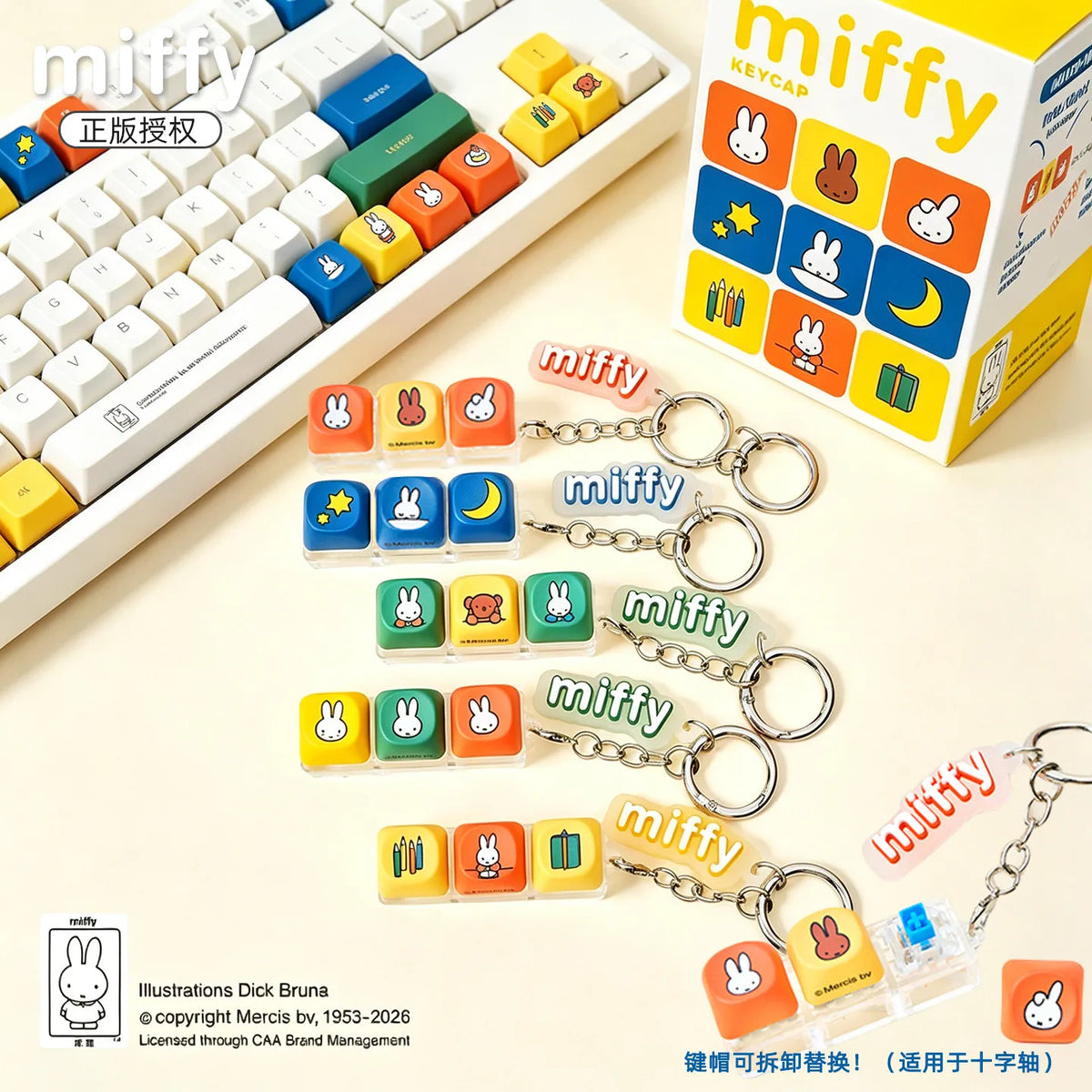 A collection of Miffy keycap pendants and blind box collectibles displayed next to a keyboard.