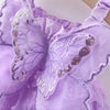 A purple princess-style butterfly suspender dress for a baby girl with sheer fabric and sparkly embellishments.
