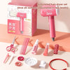 A pink simulated hair dryer set for kids includes a hairdryer, combs, scissors, and various styling tools.