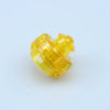 A close-up view of yellow gyro drivers for spinning tops.