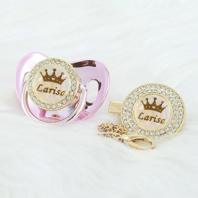 Personalized rose gold crown pacifier and clip set with a sparkling crown design