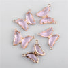 A set of delicate pink crystal butterfly charm beads for jewelry making