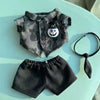 A set of Halloween pumpkin costume accessories for dolls, including a camouflage shirt and black shorts.