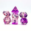 A set of crystal-style polyhedral dice in various shapes and colors, including a pyramid and a dodecahedron.