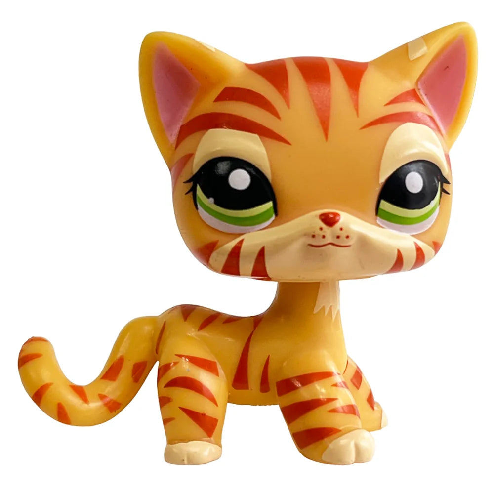 A charming bobble head pet figurine of an orange tabby cat with green eyes and striped fur.