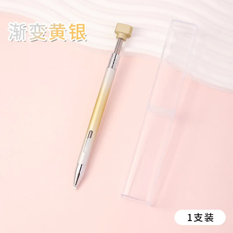 A gold-colored gradient rotating dotting pen is shown next to its clear plastic case.