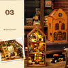A wooden miniature dollhouse kit featuring an ornate, detailed structure with various tiny figures and elements.