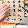 A hand holds a black brush pen writing on light-colored paper, demonstrating quick drying calligraphy.