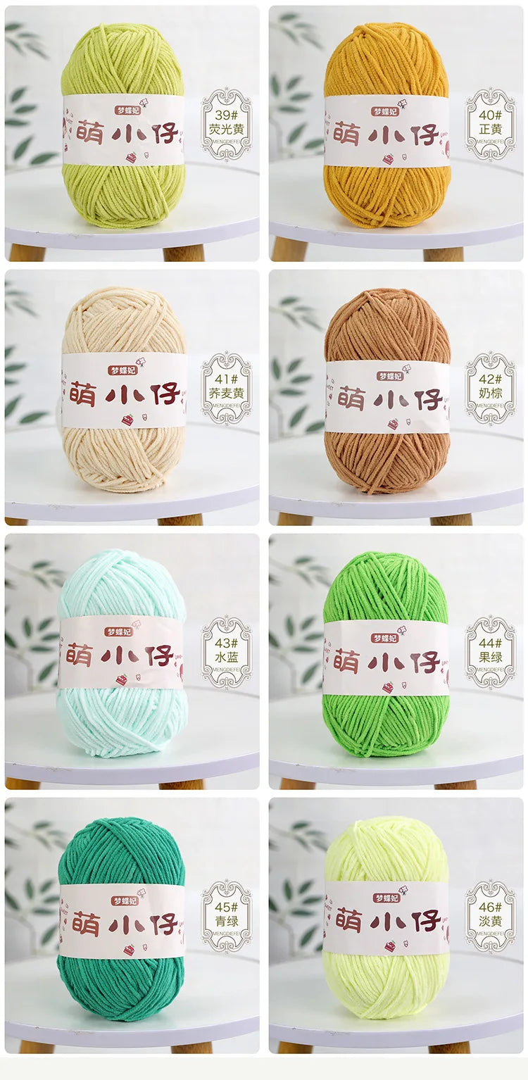 A collection of bright green, yellow, and light blue chenille yarn balls with labels indicating different thicknesses.