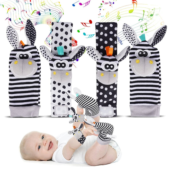 A set of cute stuffed animal rattle toys featuring black and white striped fabric with large ears and a soft body.