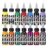 A collection of fourteen colored tattoo inks in glass bottles displayed against a white background.