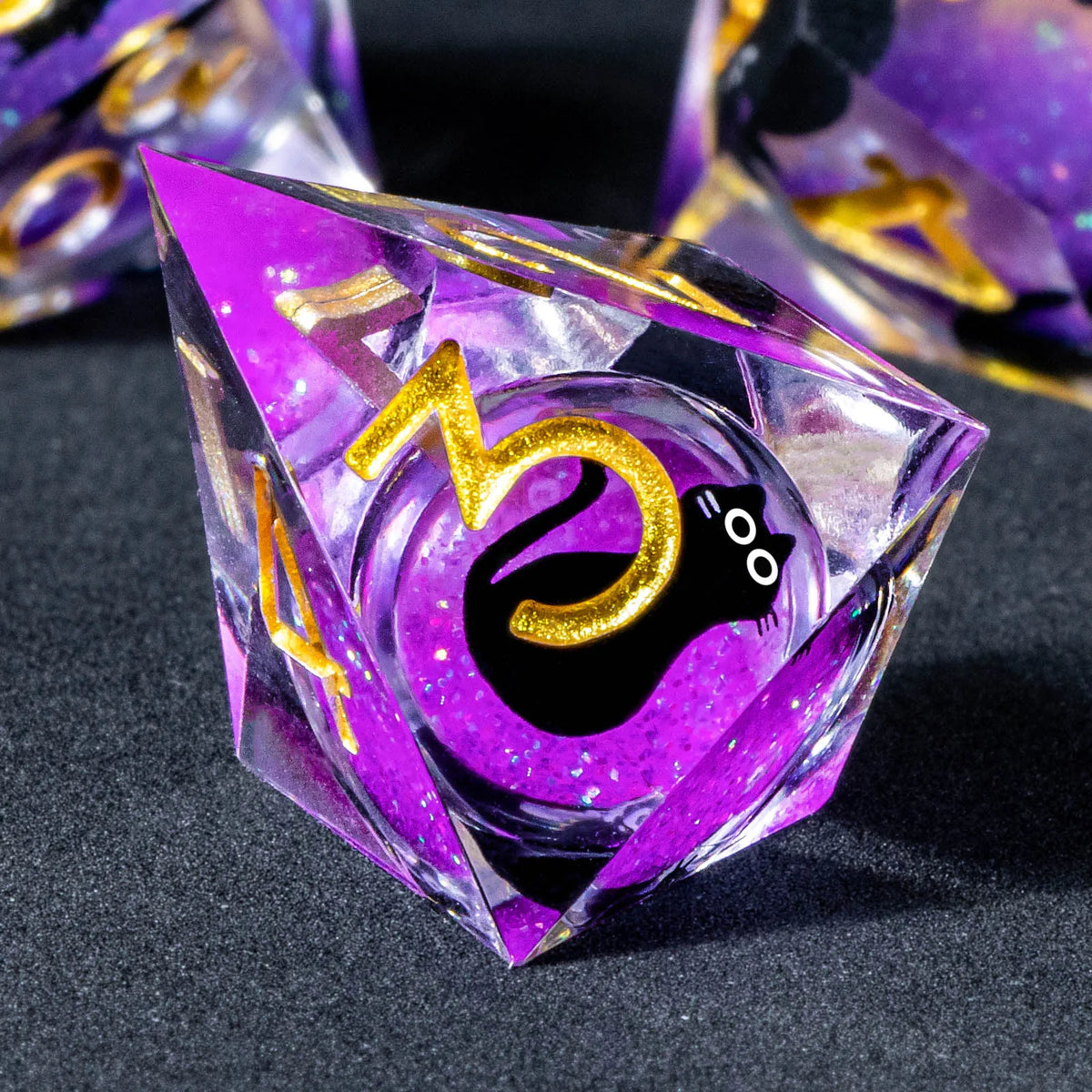 A purple liquid core resin die set featuring zodiac symbols like the Taurus sign and a black cat silhouette.