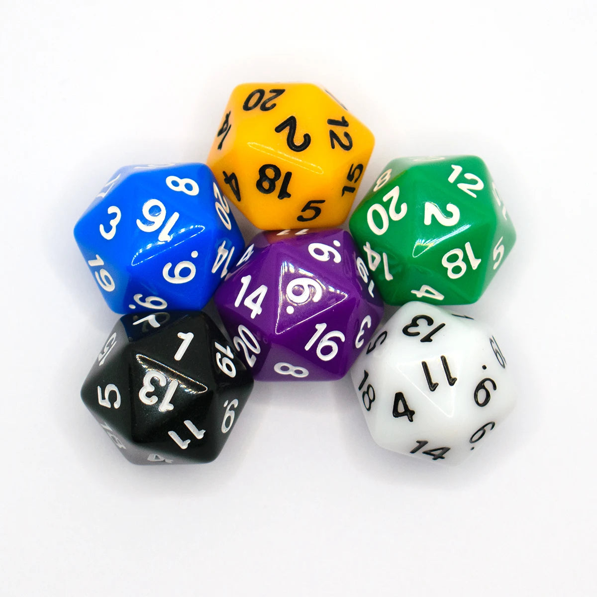 A set of seven polyhedral dice in various colors including yellow, blue, green, purple, and black.
