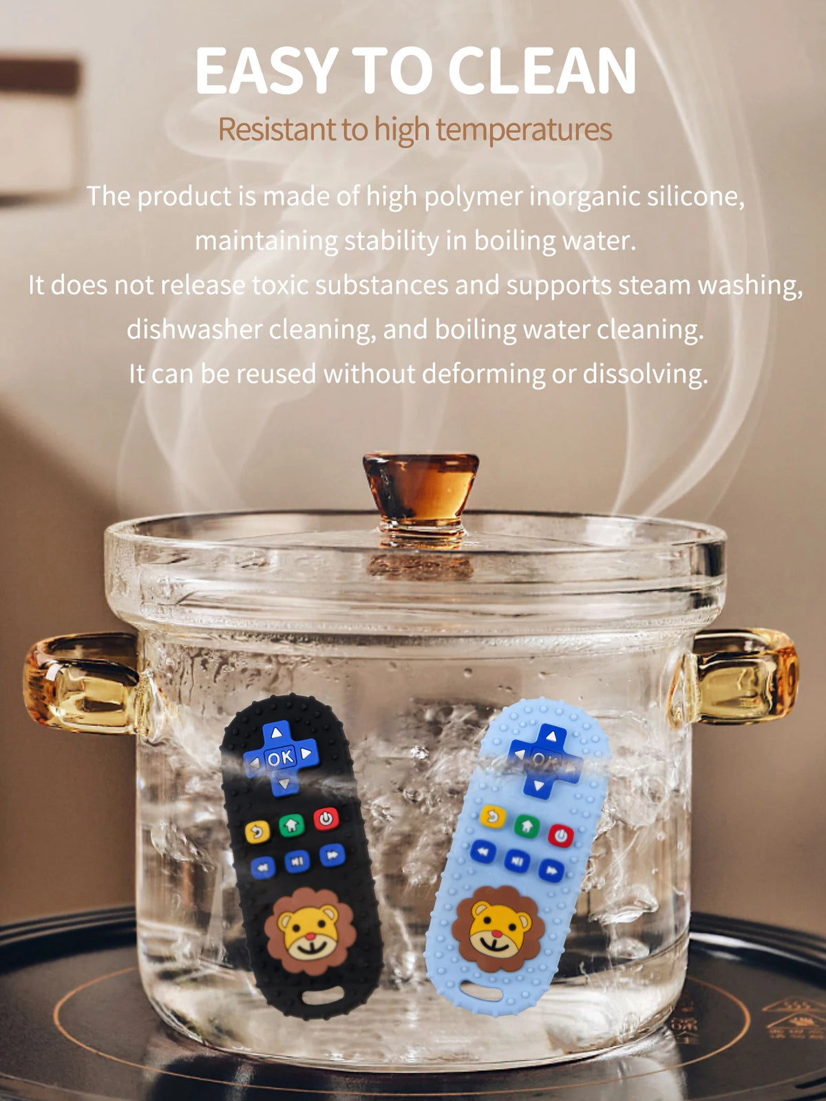 A clear glass container holds a lion-shaped silicone baby teether with a remote control design, surrounded by ice.