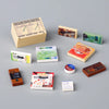 A collection of mini building blocks featuring food items like pizza, cake, and condiment bricks.